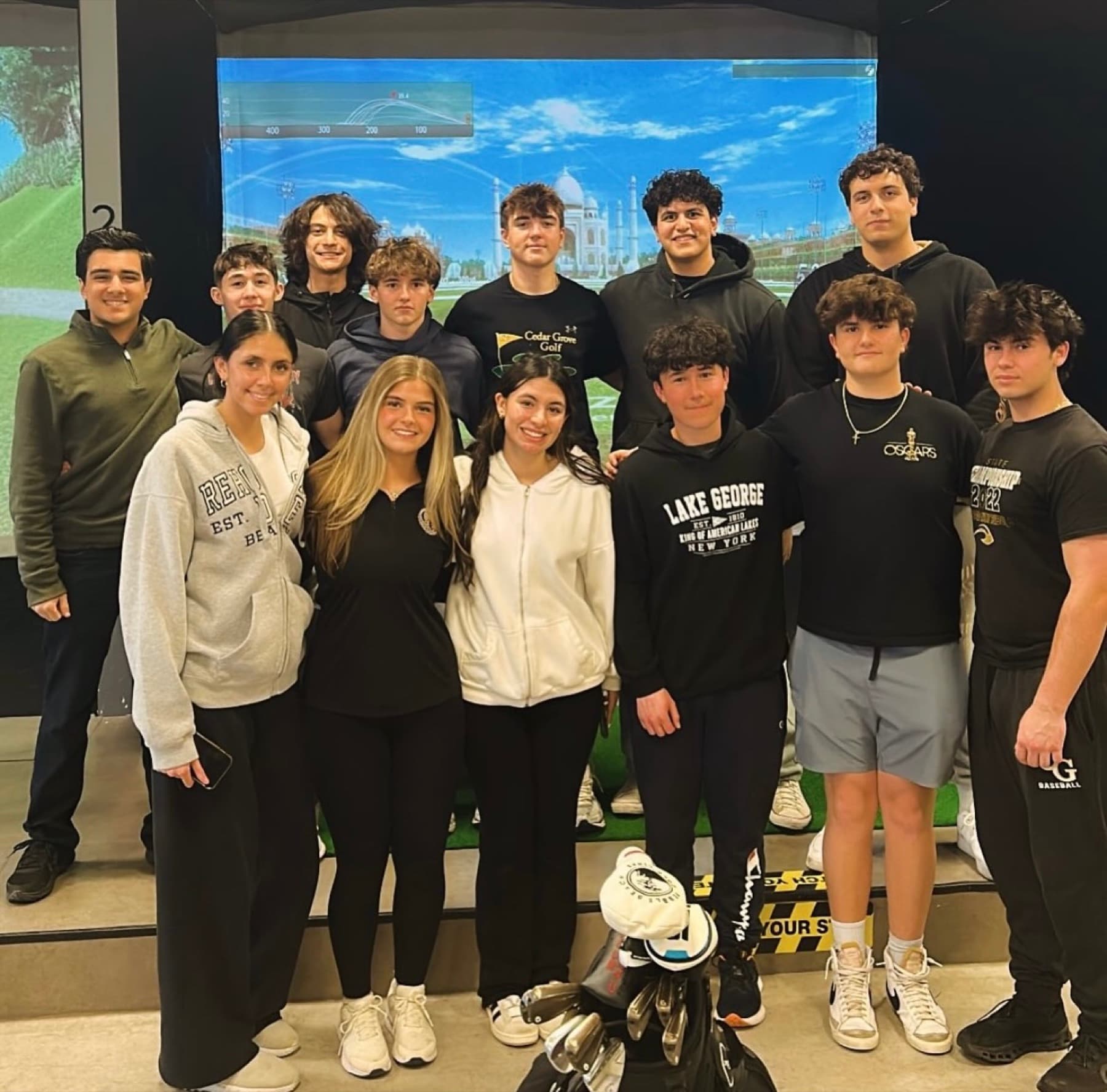 Junior golfers and Golf Paradise staff inside the Verona simulator club